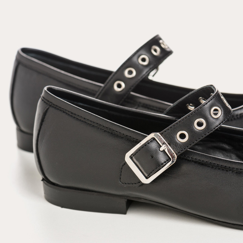 Black leather mary janes with eyelet flanges and silver loops
