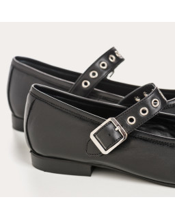 Black leather mary janes with eyelet flanges and silver loops