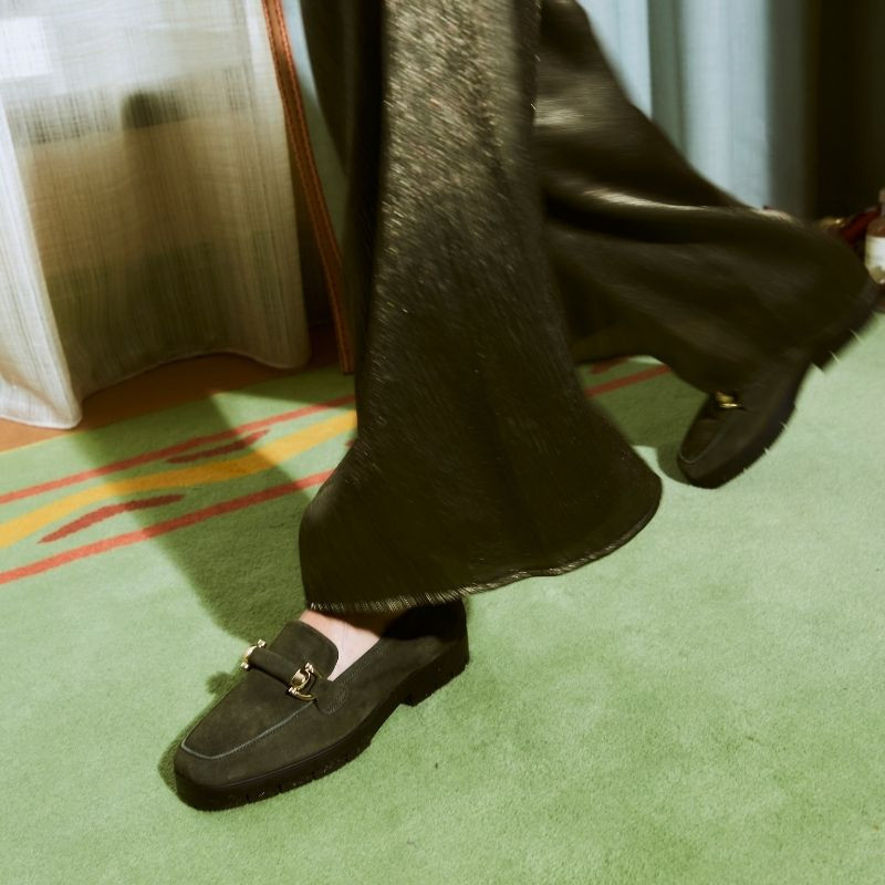 Suede moccasins with notched soles and golden accessories